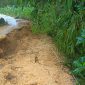 Caption: Kondisi Jalan Yang Ambruk Akibat Longsor dan Hujan Deras di Dusun Dibajak, Desa Karangpenang Onjur, Kecamatan Karangpenang (Sumber Foto: Milik Warga/dok Pilar Pos)